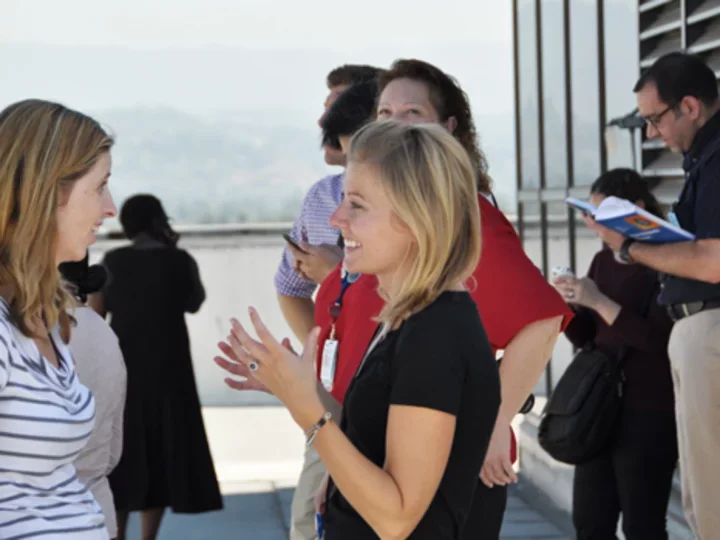 Group of people talking outside building
